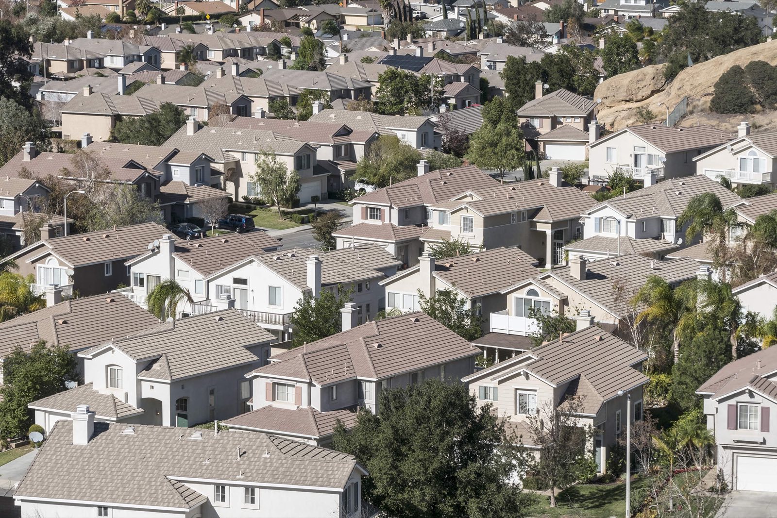 Aerial view of a Southern California residential community, tile roofs and curving streets